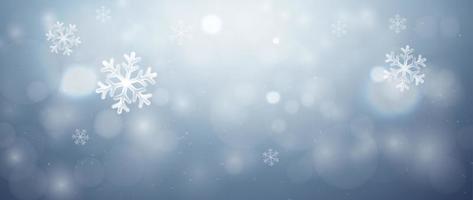 Merry Christmas background. Shiny blue sky background blurred with white crystal snowflakes and beautiful light bokeh. Christmas vector background