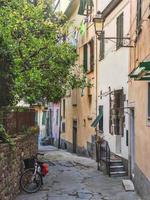 cinque terre, ancient road of Liguria with bicycle on the roadside and houses photo