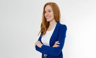 Happy red haired business woman in template blank white t shirt and stylish jacket isolated on gray background. Self career and job consulting knowledge. Young ceo entrepreneur and casual clothes photo