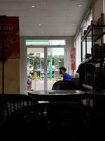 Jakarta, Indonesia in April 2022. Visitors to a cafe are waiting for their orders to be made. This cafe sells a variety of coffee drinks, chocolate and others photo