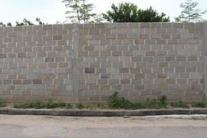 The architecture of the wall building on the side of the road was taken with an angled lancape position with a natural bright background texture photo