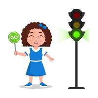 Girl with a sign to go. The traffic light shows a green signal