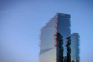 Office glitch building on blue background. Abstract digital background. Glitch city noise texture. Technology background digital glitch effect. photo