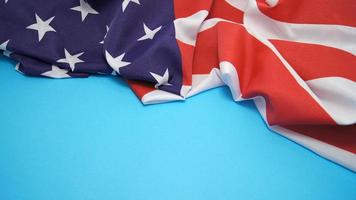 Flag of the United States of America on light blue background photo