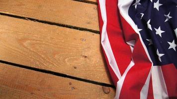 Flag of the United States of America on wooden wooden floor. The Star Spangled Banner photo