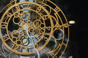 Abstract image with mechanical clocks of unusual and strange design. Metal composition, like a clockwork photo