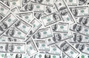 A pattern of many dollar bills. Background image photo