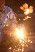 the blacksmith polishing metal products photo