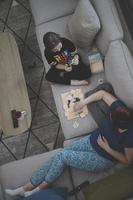 mother and daughter at home playing memory game photo