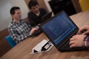 programmer writing programming code photo