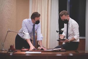 business people wearing crona virus protection face mask on meeting photo