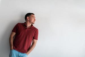 Formal business male portrait. A confident successful casual businessman or manager stands in front of a white background. photo