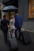 business people couple entering  hotel photo