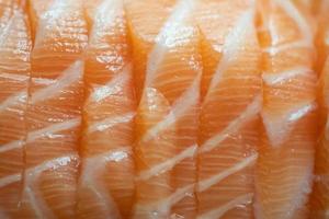 Close up raw fresh Salmon fish meat filleted piece. photo