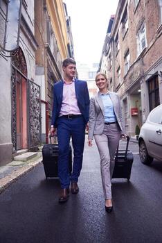 business people couple entering  hotel photo