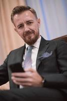 Portrait of smiling ceo at modern office in stylish suit photo