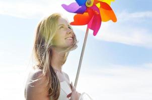 beautiful bride outdoor with colorful windmill toy photo