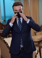 business man wearing protective face mask at office photo