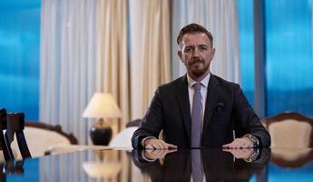 Portrait of smiling ceo at modern office in stylish suit photo