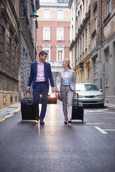 business people couple entering  hotel photo