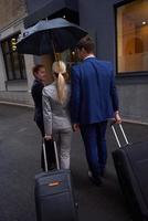 business people couple entering  hotel photo