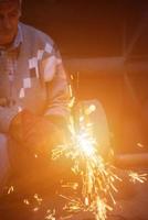 the blacksmith polishing metal products photo