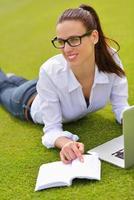 woman with laptop in park photo