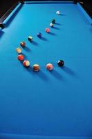 young man play pro billiard game photo