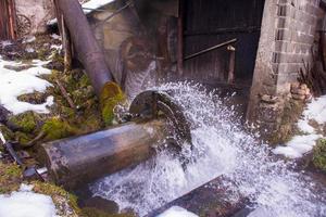 Rural landscape with old watermill in woods photo