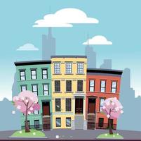 Urban area of low bright colored houses against the background of the silhouette of large city with flowering trees in the foreground. Spring cityscape on a sunny day.Flat cartoon vector illustration