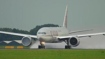 AMSTERDAM, THE NETHERLANDS JULY 24, 2017 - Qatar Cargo Boeing 777 A7 BFL accelerate before departure at Polderbaan 36L, rainy weather, Shiphol Airport, Amsterdam, Holland video