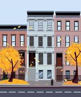 Flat cartoon style vector illustration of an autumn city street. Three-four-story houses. foliage flies from the trees. Street cityscape. Day city landscape with autumn trees in the foreground