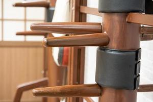 Wing Chun Wooden Dummy. Chinese kung fu practice dummy tool photo
