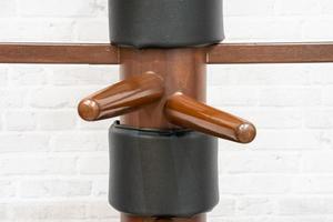 Wing Chun Wooden Dummy. Chinese kung fu practice dummy tool photo