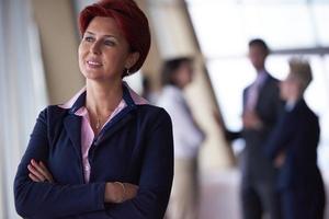 business people group, woman in front  as team leader photo