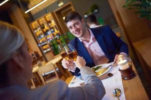 business couple having dinner photo