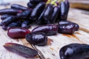 Witch grapes, moon drops, grapes or sweet sapphires picked from the garden fresh and new. It is a seedless grape that is sweet and delicious. photo