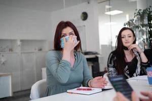 business team in protective medical mask at  modern office photo