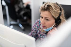 call center operator in medical mask photo