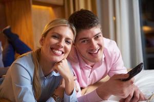 young couple in modern hotel room photo