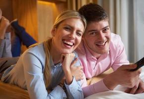 young couple in modern hotel room photo