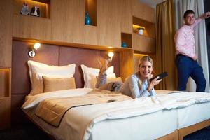 young couple in modern hotel room photo