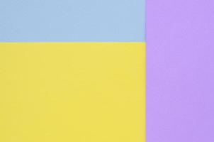 Texture background of fashion pastel colors. Violet, yellow, and blue geometric pattern papers. minimal abstract photo