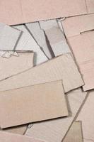 Background image with a lot of beige cardboard paper, which is used to make boxes for the transport of home appliances and postal parcels. Carton texture photo