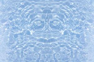 Defocus blurred transparent blue colored clear calm water surface texture with splash, bubble. Shining blue water ripple background. Surface of water in swimming pool. Blue bubble water shining. photo