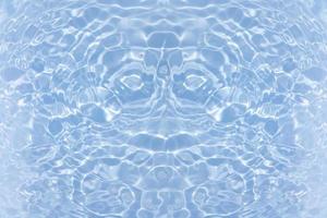 Defocus blurred transparent blue colored clear calm water surface texture with splash, bubble. Shining blue water ripple background. Surface of water in swimming pool. Blue bubble water shining. photo