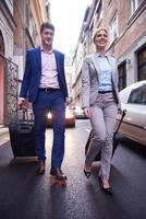 business people couple entering  hotel photo