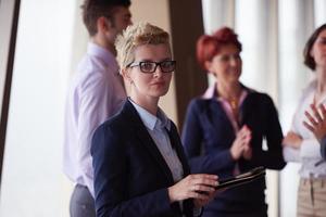 diverse business people group with blonde  woman in front photo