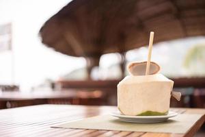 Fresh coconut at the tropical resort beach bar. photo