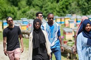 people group visiting local honey production farm photo